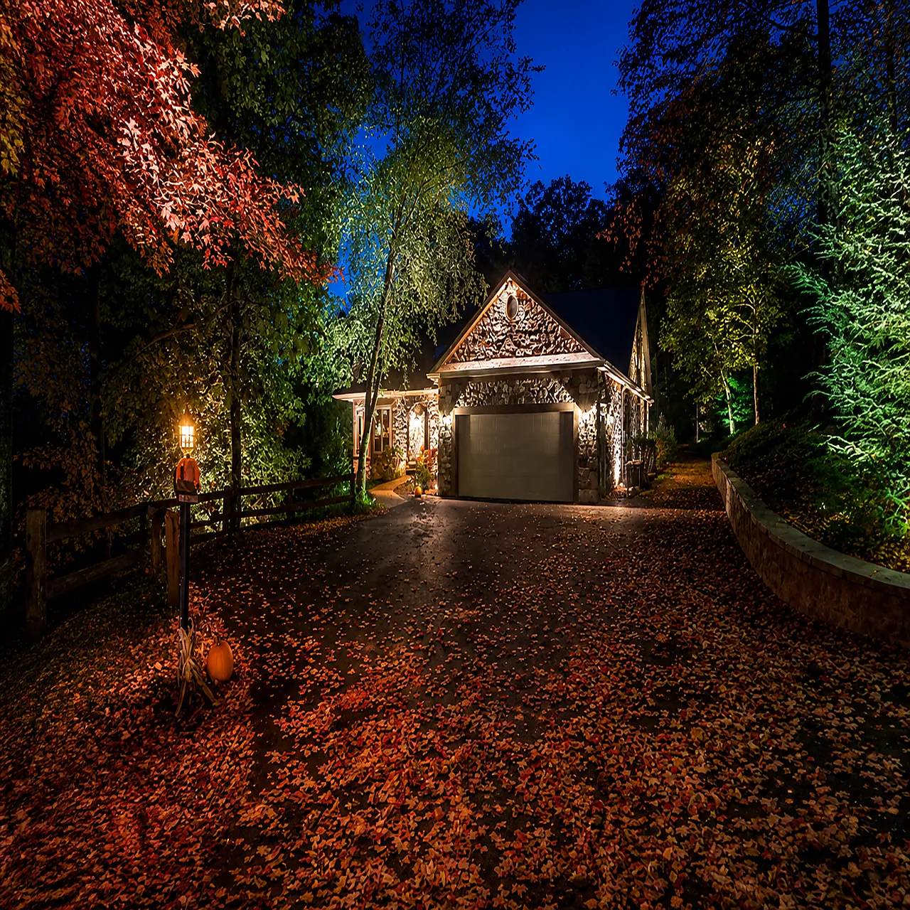 FX landscape lighting illuminating a home facade at night