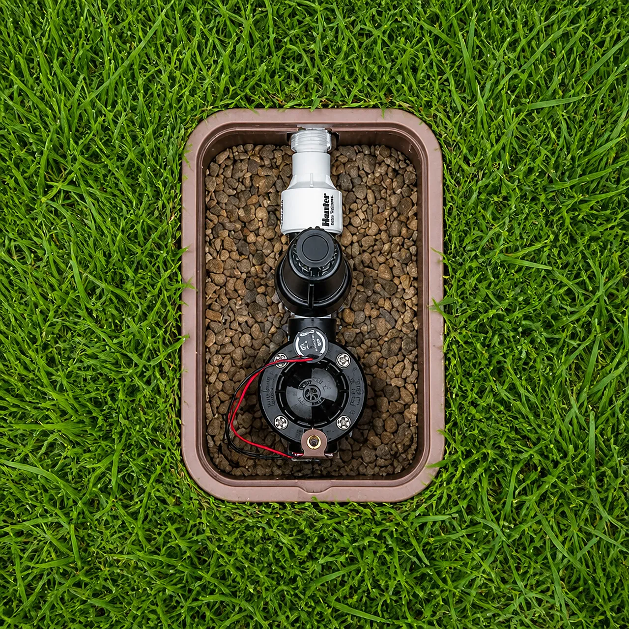 Hunter filter regulator and valves installed in a lawn valve box